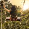 Swinging from a rope swing in Bali