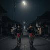 Representative image of pecalang - bali's traditional security - patrolling at night.